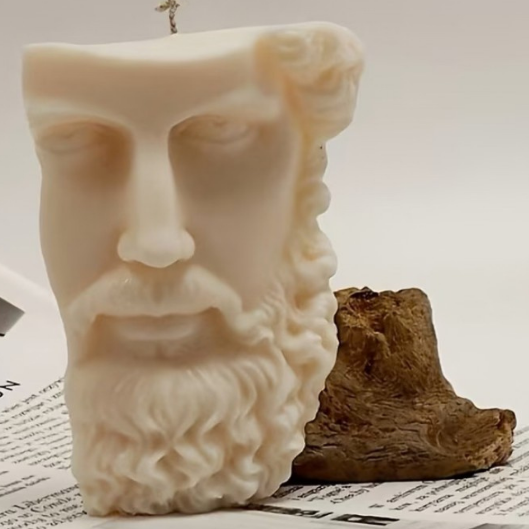Candle shaped like a face with a beard on a newspaper background