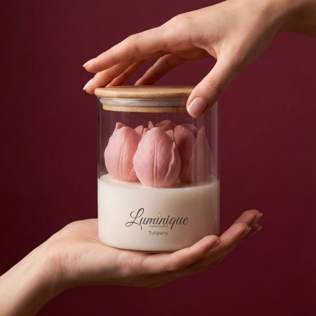Glass jar with pink tulips and wooden lid held by a hand against a dark red background